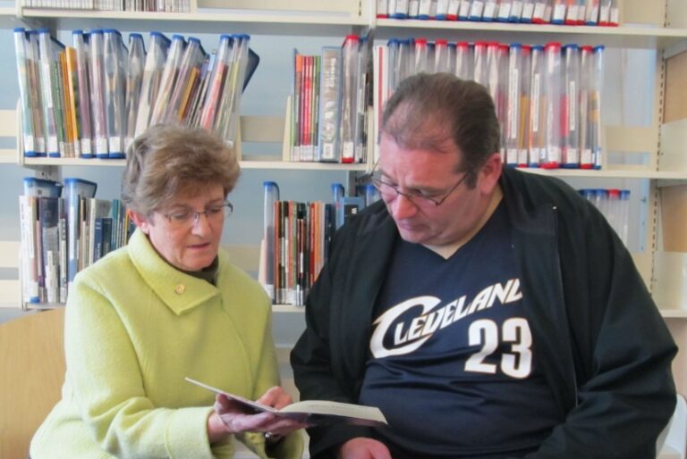 Partners Program image showing a volunteer and a learner